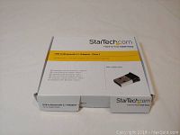 Closed product box showing Startech USB to Bluetooth 2.1 Adapter branding and product image.