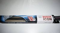 Single Bosch Icon 22OE 22-inch windshield wiper blade in original packaging shown horizontally.
