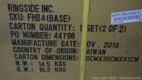 Close up of the carton label showing SKU, manufacturing date, weight, and origin of the punching bag base.