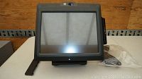Front view of the NCR POS terminal showing the touchscreen display and stable base stand.