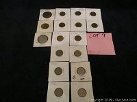 Full lot of 16 coins mostly vintage pennies arranged in cardboard flips, with visible date labels.