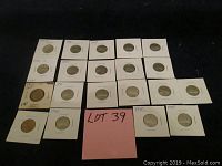 Overview photo of twenty vintage Canadian nickels from 1940 to 1949, mounted individually in white coin holders arranged in rows on a black background.