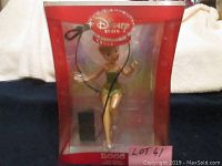 Original boxed Disney 2008 Tinkerbell Christmas tree topper figurine, showing figure in green dress inside see-through red box with Disney Store branding.