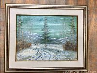 Framed original oil painting showing the entire artwork with winter landscape scene and frame.