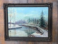 Full view of the framed oil painting showing the landscape and ornate frame