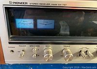 Close-up of front panel meters showing signal and tuning VU meters