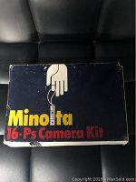 Original blue Minolta 16-Ps Camera Kit labeled box with visible wear but intact graphics.