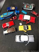 Photo of the entire lot with all models visible on a flat dark surface