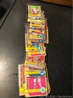 Stack of 40 Topps 1971-72 NHL hockey cards, showing a variety of player images and names visible on card fronts. Cards have yellow border design and are lightly used.