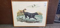 Full view of the framed print showing one yellow and one black Labrador near water, with some birds flying above and reeds in the background.