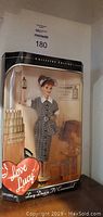 Full view of I Love Lucy themed Barbie doll in collector edition packaging.