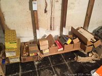 Overall view of Sargent lock set boxes and loose hardware on floor