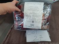 Photo of the packaged duvet cover set with the product label showing brand and material.