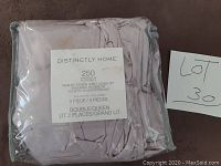 Packaged Distinctly Home 250 Thread Count Washed Sateen Duvet Cover Set in light pink/beige color, queen/double size in plastic wrapping with set label.