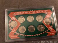 Front view of 1993 American Frontier Nickel Set in hard plastic case, showcasing eight nickels with Indian Head design and Buffalo design text.