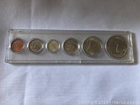 Top view of one plastic holder containing 6 circulated 1967 Canadian coins.