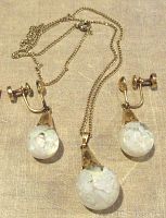 Photo shows vintage gold filled chain and matching earrings with white glass balls containing iridescent flakes that resemble opals.
