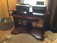 Full view of dark wood computer desk with two printers on top. Shows entire structure including base shelf and keyboard tray.