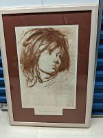 Framed lithograph showing a woman's portrait in brown ink on cream paper, signed by Pietro Annigoni.