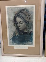 Framed lithograph art print of a lady's portrait by Pietro Annigoni, signed and dated 1965, matted in light tan and framed in a light wood frame.