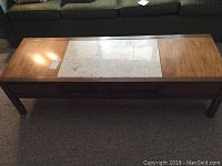 Rectangular wooden coffee table with marble inlay top, two drawers visible underneath, shown from front top angle.