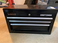 Front view of black Craftsman Limited Edition toolbox with two drawers and lock.