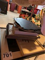 Stack of various picture frames including one with a vintage map or print