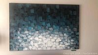 Full view of the canvas showing the overall abstract pixelated brush stroke design in blue, gray, and white hues.