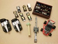 Overall view of lot with Star Wars themed items, toy cars, Pez dispenser, and toy go-kart