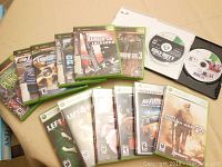 Photo of Xbox and Xbox 360 game cases and discs showing titles and condition.