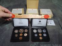Four Royal Canadian Mint uncirculated coin sets from 1972, 1973, 1976, and 1977, each in mint-issued cases with original informational booklets.