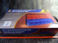 Box of Powerfist 30 piece wall mounted storage bins set showing product name, image of red and blue bins on black mounting rails, and measurement scale for size reference.