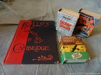 Group photo of the four books showing covers of 'Rollo's Journey to Cambridge' and three WWII era mini comic books 'Smokey Stover,' 'Mole Gang,' and 'Tailspin Tommy.'