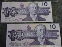 Front view of two 1989 $10 Canadian bills with Sir John A. Macdonald portrait