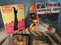 Four art history books displayed including La Belle Epoque, Modern Art, Cubism, and Arts & Crafts.