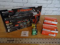 Full lot setup showing Ramset MasterShot tool in packaging with boxes of powder charges and nails.
