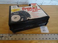 Closed black plastic case showing foam-lined top, ‘Freud dial-a-width Dado’ label, starburst ‘Shimless Stacked Dado!’ and lot number card.
