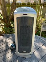 Front view of the Lasko tall space heater tower showing the mesh grille and Lasko logo.