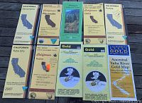 Full overview of 10 gold mining maps laid out showing titles and California locations including Sacramento, Placerville, Chico, Portola, Yuba City, Truckee, some BLM editions, and specific gold mining areas.