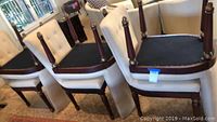 Group of six chairs showing overall set arrangement and partial underside view of two chairs