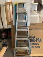 Front view of Keller aluminum ladder, silver with commercial design.