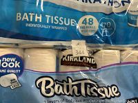 Photo showing Kirkland and Marathon branded toilet paper packs stacked, detail on Marathon pack text and quantity of 48 big rolls.