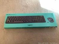 Logitech MK270 keyboard and mouse combo box on floor.