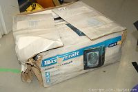 Damaged box with Mastercraft branding and 5000W power label visible.