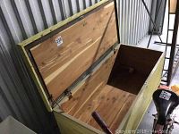 Open lid showing cedar wood lining inside the chest with natural wood finish and cedar wall lining.