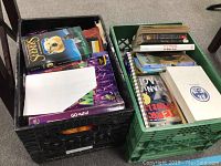 Two crates filled with a mix of hardback and softcover books including Seekers and Go Math workbook.