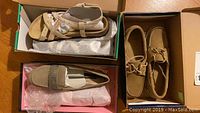 Three pairs of women's shoes: tan Betula sandals with straps and buckle, beige Stephen loafers with rhinestone strap, and tan suede Sebago dockside shoes with white laces, all in shoe boxes.