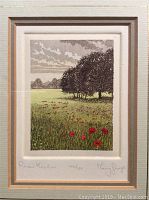 Close-up image of the block print showing the meadow scene with trees and flowers.