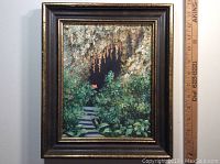 Full front view of the framed oil painting with a ruler showing frame size of 13x11 inches