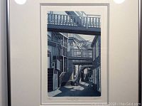 Original Jean Cencig etching aquatint in white frame depicting an alleyway with staircases and balconies, showing detailed shadow work and architectural elements.